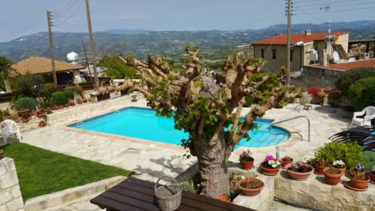 Pool and terrace looking out over the valley below the village